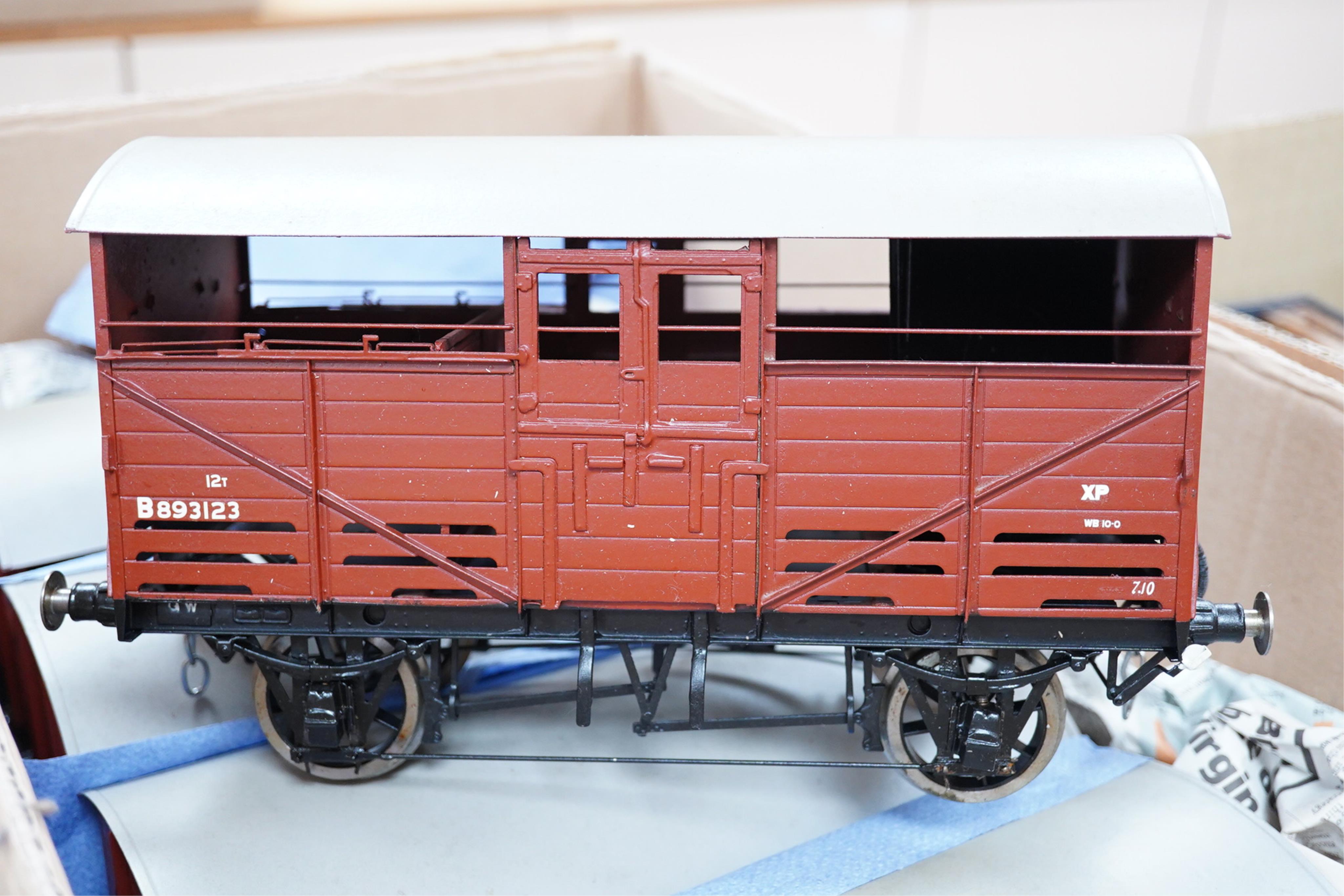 Six Gauge 3 model railway cattle trucks, of all metal construction built by Richard Toplis, well detailed and painted to a high standard